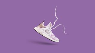 A sneaker with a purple backdrop