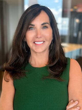 Portrait of MaryJeanne "MJ" Scott, CEO of Kirk Palmer Associates